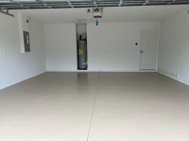3838 W Baton Ln, Citrus Springs, FL 34433 - garage featuring water heater, a garage door opener, and electric panel