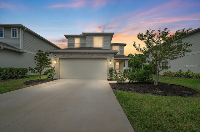 3916 Southern Vista Loop, Saint Cloud, FL 34772 - view of front facade featuring driveway, a garage, and a lawn