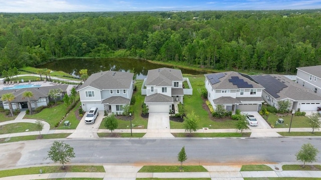 3916 Southern Vista Loop, Saint Cloud, FL 34772 - aerial view of residential area featuring a heavily wooded area and a nearby body of water