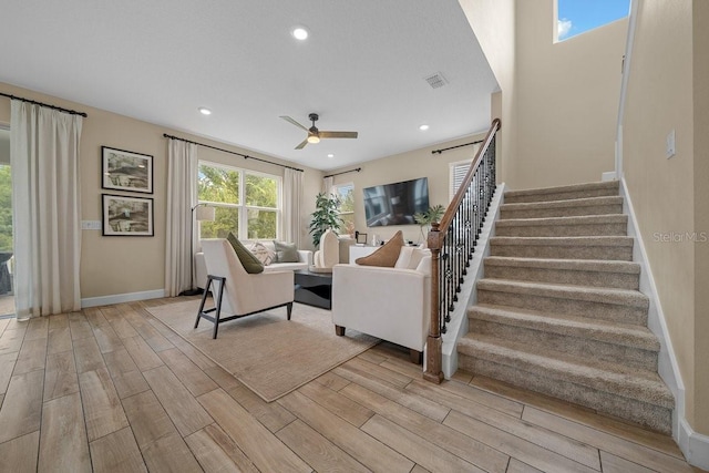 3916 Southern Vista Loop, Saint Cloud, FL 34772 - living area featuring light wood-style floors, stairs, ceiling fan, and recessed lighting