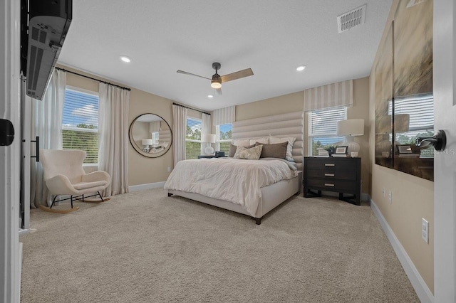 3916 Southern Vista Loop, Saint Cloud, FL 34772 - carpeted bedroom featuring multiple windows, ceiling fan, and recessed lighting