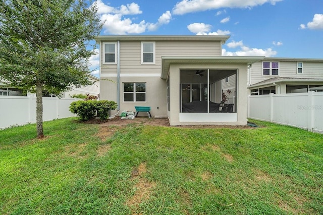 3916 Southern Vista Loop, Saint Cloud, FL 34772 - rear view of property with a fenced backyard, a sunroom, and stucco siding