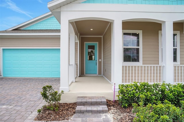 983 Fiesta Key Cir, Lady Lake, FL 32159 - property entrance with decorative driveway, a garage, and a porch