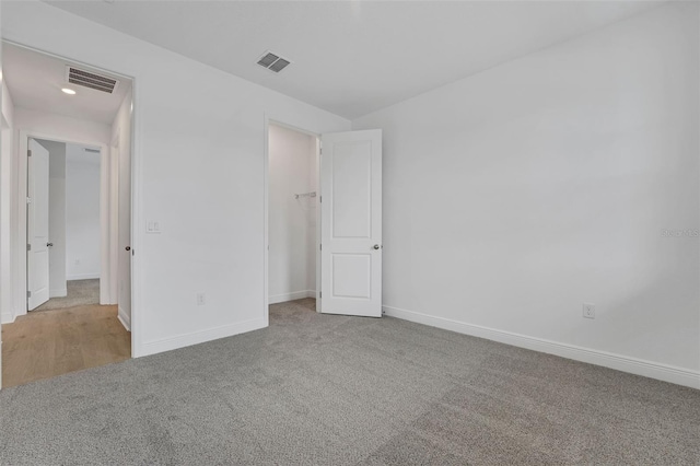 983 Fiesta Key Cir, Lady Lake, FL 32159 - unfurnished bedroom featuring carpet and baseboards