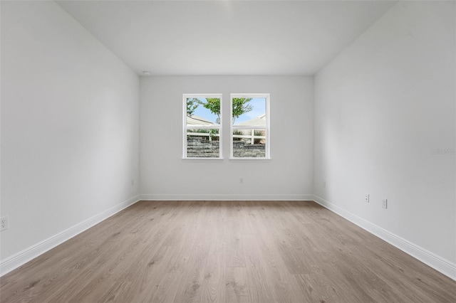 983 Fiesta Key Cir, Lady Lake, FL 32159 - unfurnished room featuring wood finished floors and baseboards