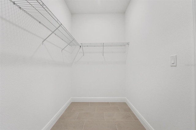 983 Fiesta Key Cir, Lady Lake, FL 32159 - spacious closet with light tile patterned floors
