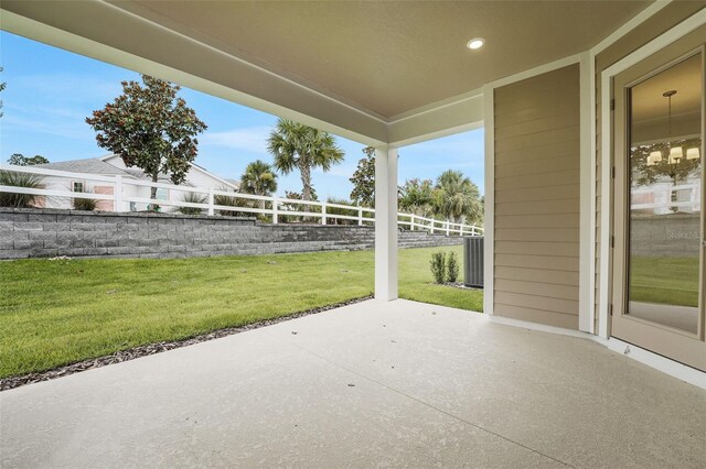 983 Fiesta Key Cir, Lady Lake, FL 32159 - fenced backyard with a patio area