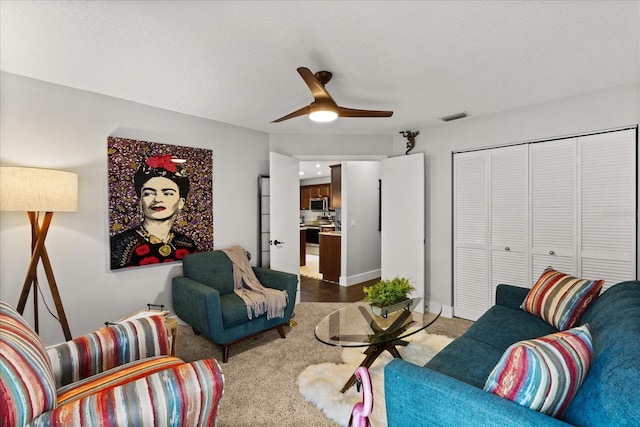 17525 SE 111th Cir, Summerfield, FL 34491 - living area featuring ceiling fan and dark colored carpet