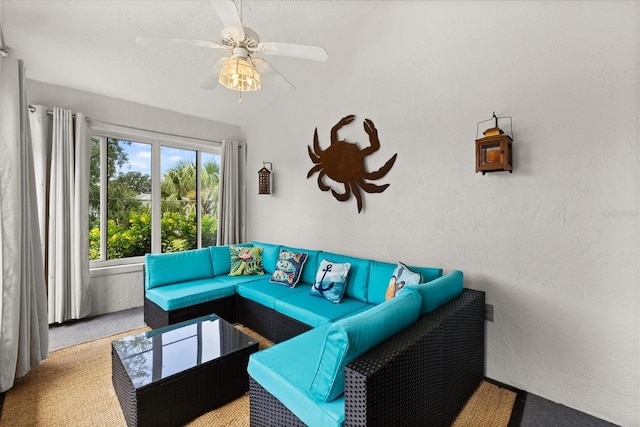 17525 SE 111th Cir, Summerfield, FL 34491 - living room with carpet flooring, a ceiling fan, vaulted ceiling, and a textured wall