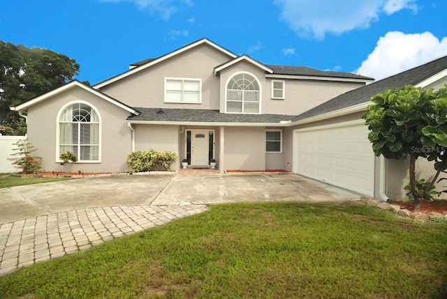 7938 Tumblestone Dr, Orlando, FL 32819 - traditional-style home featuring stucco siding, concrete driveway, a garage, and a front lawn