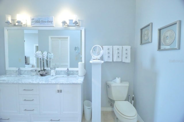 7938 Tumblestone Dr, Orlando, FL 32819 - bathroom with double vanity and tile patterned floors