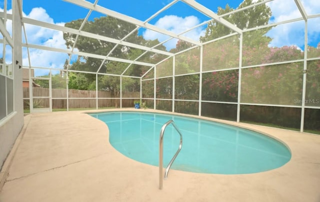 7938 Tumblestone Dr, Orlando, FL 32819 - view of swimming pool with a patio area, a fenced backyard, and glass enclosure