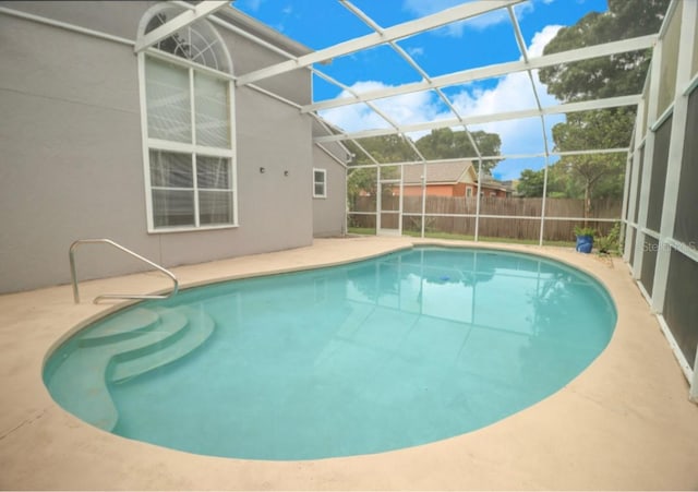 7938 Tumblestone Dr, Orlando, FL 32819 - view of swimming pool with a patio area and a lanai