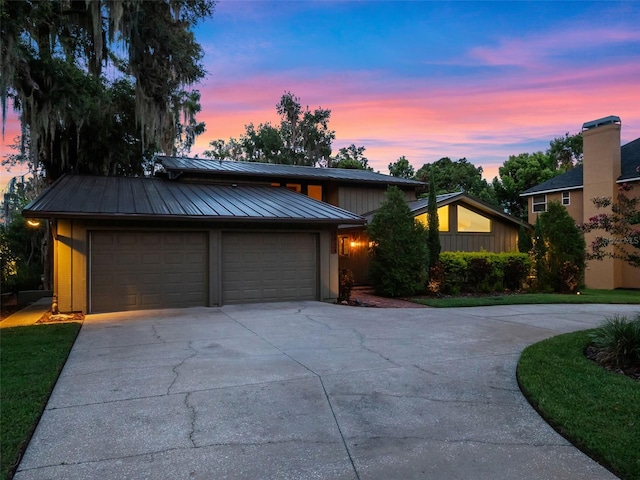 1978 Brantley Cir, Clermont, FL 34711 - mid-century modern home with driveway, a standing seam roof, and a metal roof