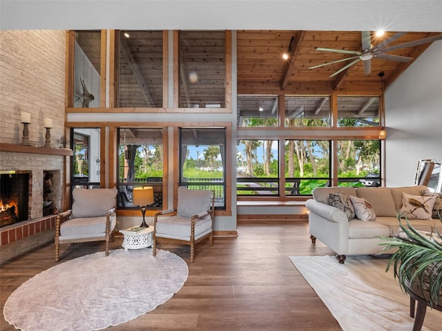 1978 Brantley Cir, Clermont, FL 34711 - living room featuring high vaulted ceiling, plenty of natural light, a ceiling fan, a wood ceiling with exposed beams, and a fireplace