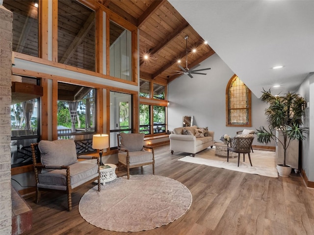 1978 Brantley Cir, Clermont, FL 34711 - living room featuring high vaulted ceiling, a ceiling fan, healthy amount of natural light, wood finished floors, and a wooden ceiling with exposed beams