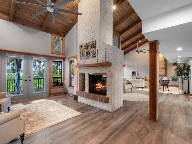 1978 Brantley Cir, Clermont, FL 34711 - living room featuring a ceiling fan, a wooden ceiling with exposed beams, high vaulted ceiling, a fireplace, and wood finished floors