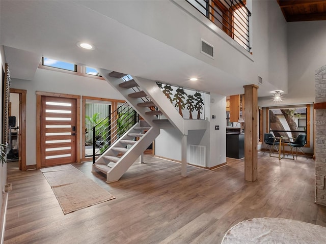 1978 Brantley Cir, Clermont, FL 34711 - entryway with wood finished floors, stairs, recessed lighting, and a high ceiling