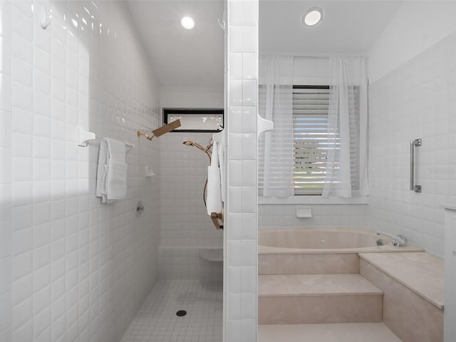 1978 Brantley Cir, Clermont, FL 34711 - bathroom with a garden tub, tile walls, tile patterned flooring, and recessed lighting