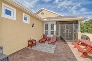 370 Salt Marsh Ln, Groveland, FL 34736 - view of patio with a sunroom