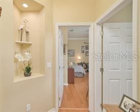 370 Salt Marsh Ln, Groveland, FL 34736 - hall featuring ornamental molding and wood finished floors