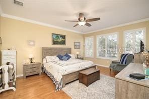 370 Salt Marsh Ln, Groveland, FL 34736 - bedroom featuring ornamental molding, wood finished floors, and ceiling fan