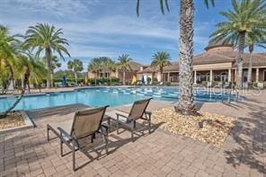 370 Salt Marsh Ln, Groveland, FL 34736 - community pool featuring a patio