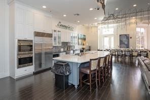 370 Salt Marsh Ln, Groveland, FL 34736 - kitchen featuring appliances with stainless steel finishes, white cabinetry, dark wood-style flooring, plenty of natural light, and recessed lighting