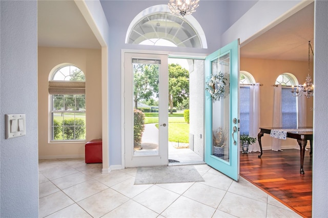 7811 Laurel View Dr, Mount Dora, FL 32757 - tiled foyer entrance featuring a chandelier and french doors
