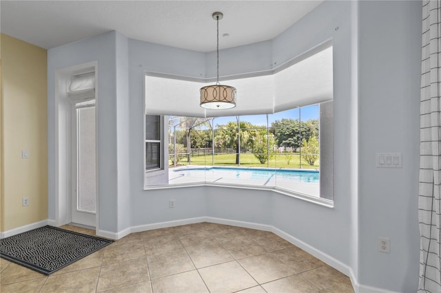 7811 Laurel View Dr, Mount Dora, FL 32757 - unfurnished dining area featuring tile patterned flooring and baseboards