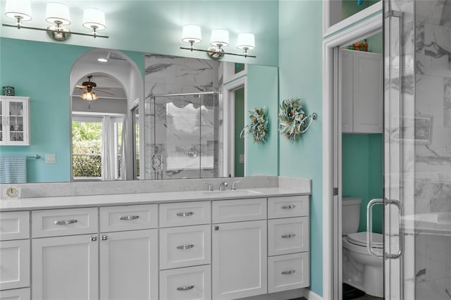 7811 Laurel View Dr, Mount Dora, FL 32757 - bathroom with a ceiling fan, vanity, and a marble finish shower