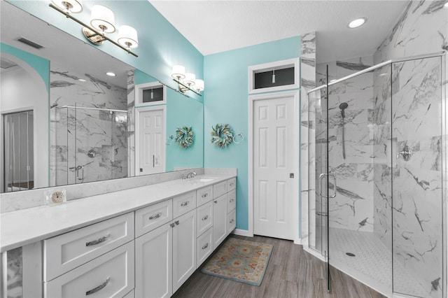7811 Laurel View Dr, Mount Dora, FL 32757 - bathroom with vanity, a marble finish shower, recessed lighting, and wood finished floors