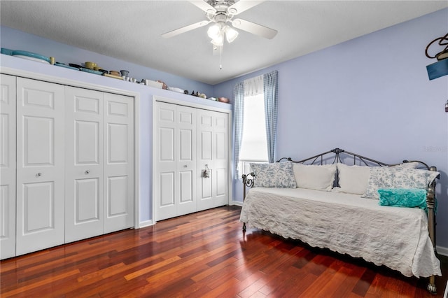 7811 Laurel View Dr, Mount Dora, FL 32757 - bedroom featuring two closets, wood finished floors, and ceiling fan