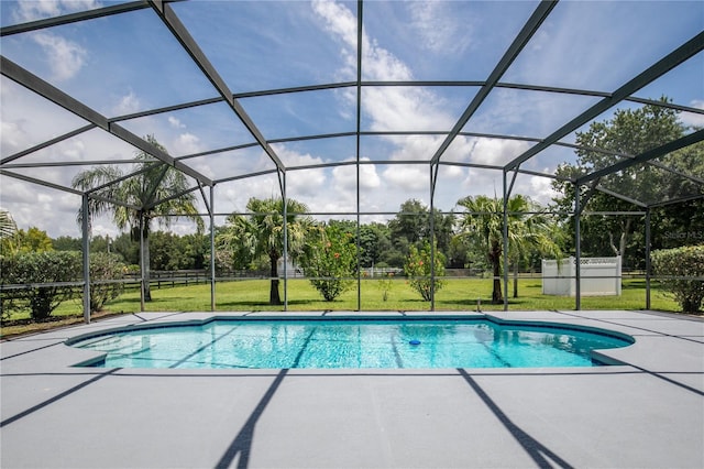 7811 Laurel View Dr, Mount Dora, FL 32757 - outdoor pool featuring a patio area, a lawn, view of scattered trees, and glass enclosure
