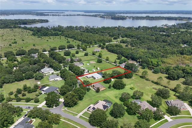 7811 Laurel View Dr, Mount Dora, FL 32757 - aerial view of property and surrounding area featuring property parcel outlined and a nearby body of water
