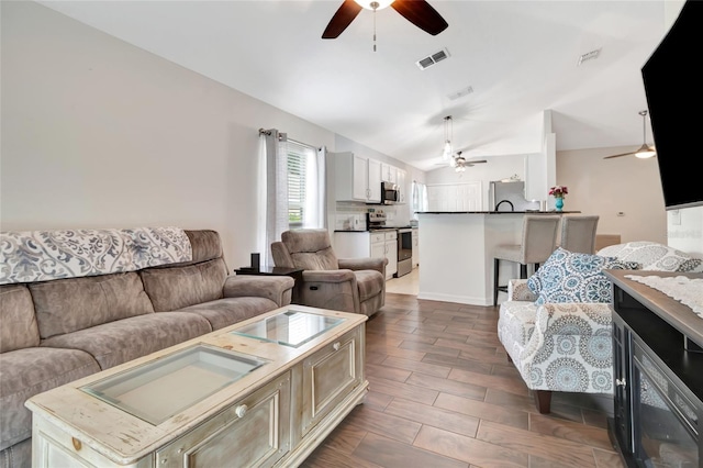 2305 Foxtree Rd, Tavares, FL 32778 - living room with ceiling fan and vaulted ceiling