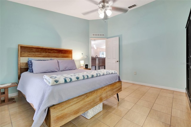 2305 Foxtree Rd, Tavares, FL 32778 - bedroom with light tile patterned floors, a high ceiling, and a ceiling fan