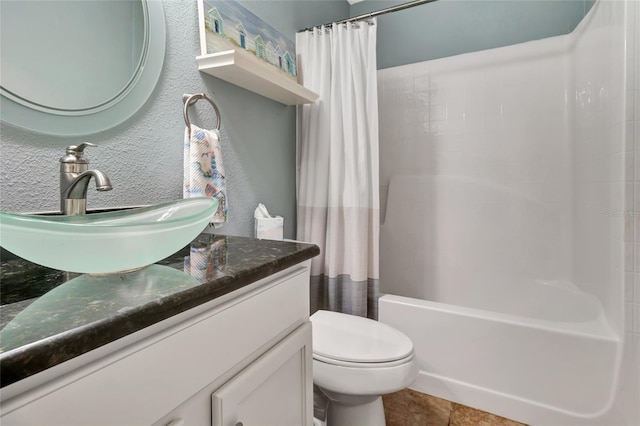 2305 Foxtree Rd, Tavares, FL 32778 - bathroom with vanity, shower / bath combo with shower curtain, a textured wall, and tile patterned floors