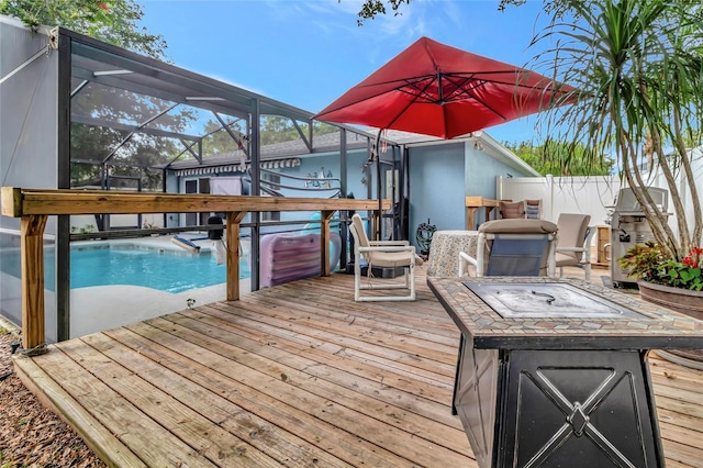 2305 Foxtree Rd, Tavares, FL 32778 - deck featuring glass enclosure, an outdoor pool, and a grill
