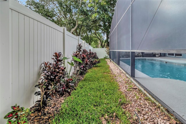 2305 Foxtree Rd, Tavares, FL 32778 - fenced backyard with glass enclosure