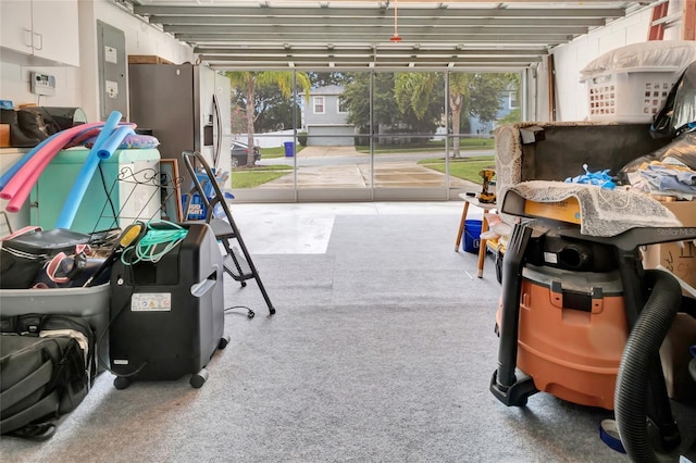 2305 Foxtree Rd, Tavares, FL 32778 - garage featuring stainless steel fridge and electric panel