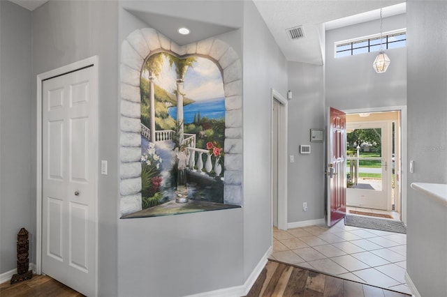 6307 Berkshire Pass, Leesburg, FL 34748 - foyer entrance featuring wood finished floors and baseboards