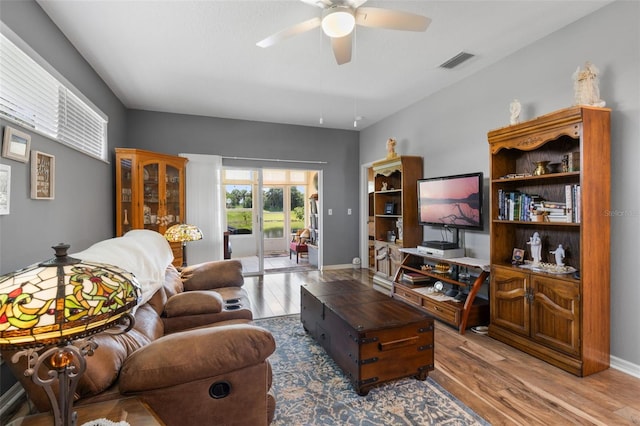 6307 Berkshire Pass, Leesburg, FL 34748 - living area featuring wood finished floors and ceiling fan