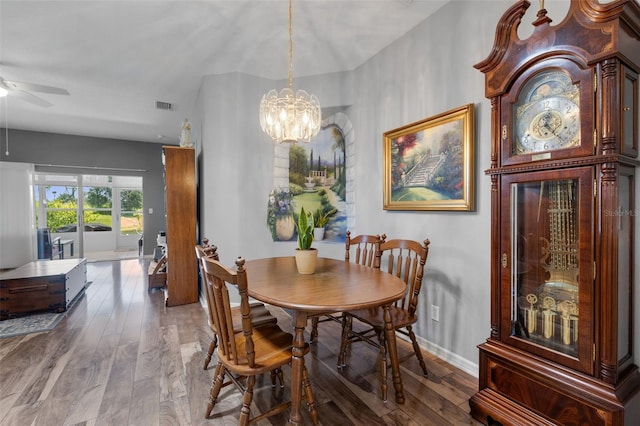 6307 Berkshire Pass, Leesburg, FL 34748 - dining room with a ceiling fan, wood finished floors, and a chandelier