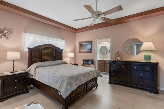 6307 Berkshire Pass, Leesburg, FL 34748 - bedroom featuring light wood-style flooring, a ceiling fan, and ensuite bathroom
