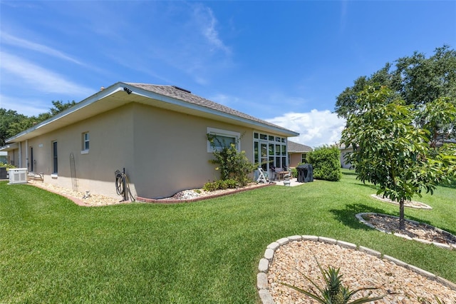 6307 Berkshire Pass, Leesburg, FL 34748 - view of home's exterior featuring stucco siding and a yard