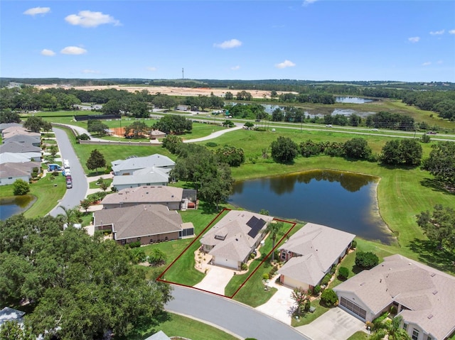 6307 Berkshire Pass, Leesburg, FL 34748 - aerial view of residential area with a nearby body of water and property parcel outlined