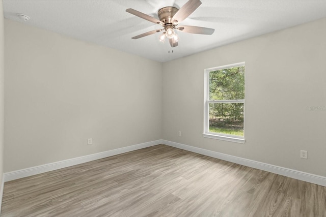 671 E Toledo Dr, Citrus Springs, FL 34434 - unfurnished room featuring light wood finished floors, a ceiling fan, and a smoke detector