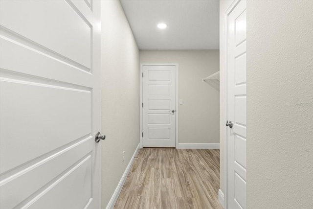 671 E Toledo Dr, Citrus Springs, FL 34434 - hall featuring light wood-type flooring and recessed lighting
