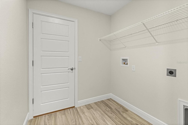 671 E Toledo Dr, Citrus Springs, FL 34434 - laundry room with hookup for an electric dryer, hookup for a washing machine, and light wood-style flooring